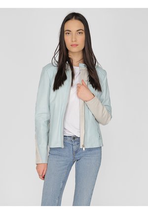 Light blue leather jacket with a fitted design, front zip closure, and cream accents on the sleeves. Worn over a white top and jeans.