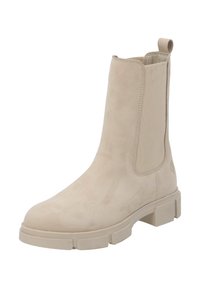 Botín beige con un acabado de ante suave, paneles laterales elásticos y una suela de goma gruesa. Cuenta con una lengüeta en la parte posterior para facilitar su uso.
