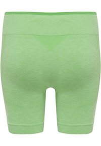 Gröna, sömlösa shorts med en slät yta. Utformade med en bred midjeresår och subtila, ribbade detaljer nära fållen och sidorna.