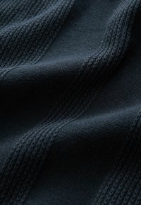 Dark blue knitted fabric featuring textured stripes with alternating smooth and open weave sections; soft texture with visible stitching.
