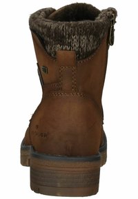 Bottines brunes en cuir avec un détail de bord en tricot, surface texturée, forme arrondie et semelle en caoutchouc plate.
