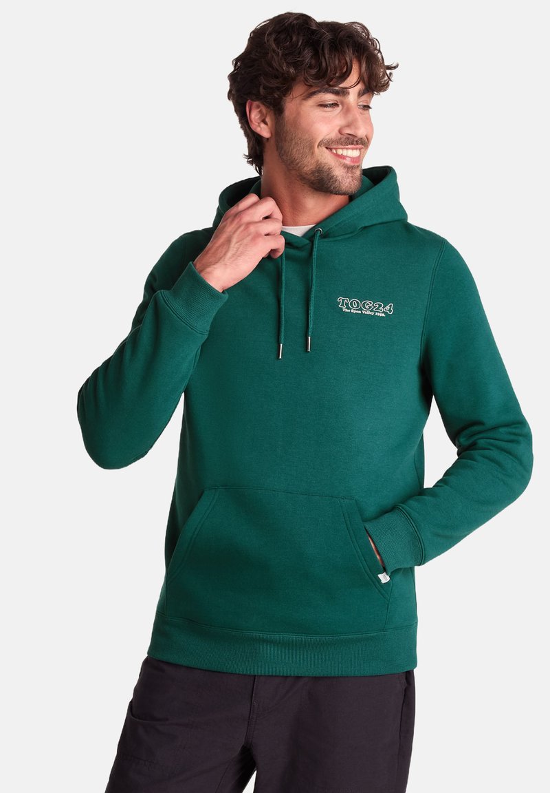 Green cotton hoodie with a kangaroo pocket, adjustable drawstrings, and a logo on the chest. Soft texture and ribbed cuffs.