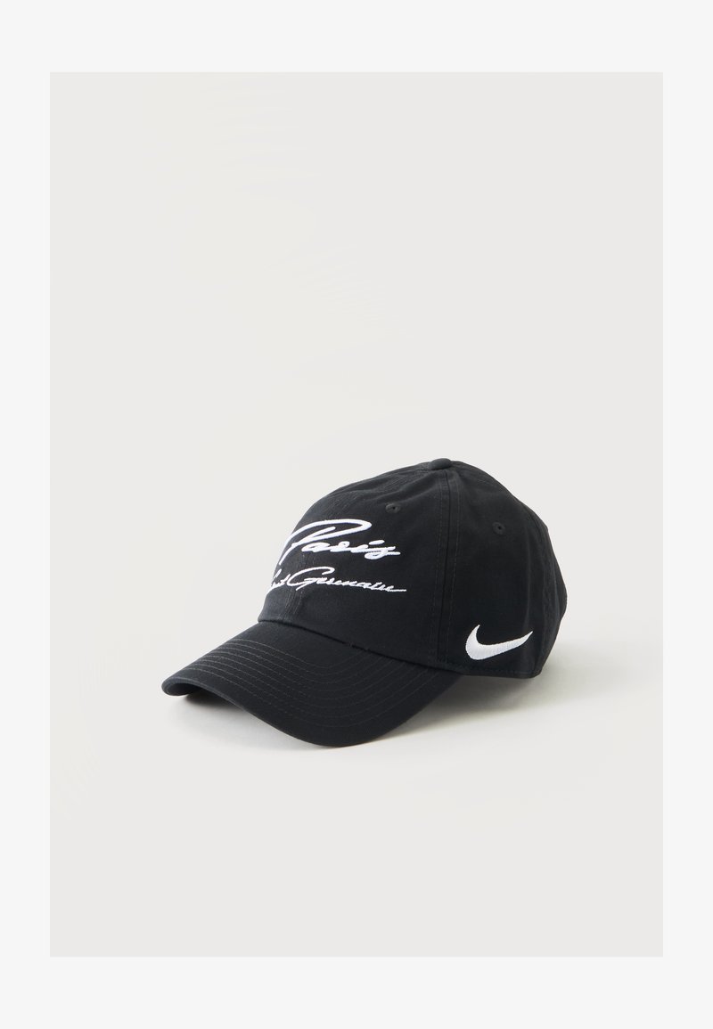 Black Nike baseball cap with white embroidered text "Paris Saint Germain" and Nike swoosh logo on side, displayed on a white surface.