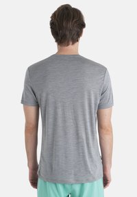 Gray short-sleeve t-shirt with a soft, smooth texture and a classic crew neck, featuring a subtle heather pattern.
