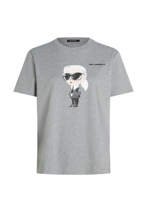 Halli puuvillane T-särk, millel on musta ülikonna ja päikeseprillidega joonistatud multifilmikujutis ning kujutise kohal tekst "KARL LAGERFELD".