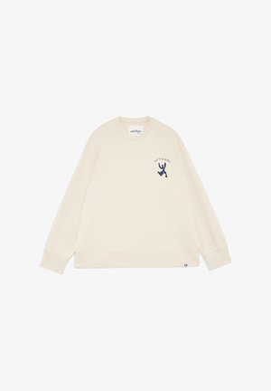 Sweat-shirt col rond couleur crème à manches longues, petit motif abstrait bleu foncé et texte "OTTOD'Ame" sur le haut gauche de la poitrine.