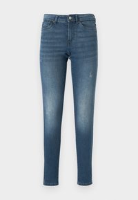 Jeans ajustados de denim azul, con áreas deslavadas y un sutil efecto de desgaste. Diseñados con una cinturilla estándar y cinco bolsillos.