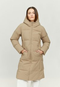 Beige puffer coat with a hood, featuring a front zipper, side pockets, and a quilted design. Smooth, insulated fabric for warmth.