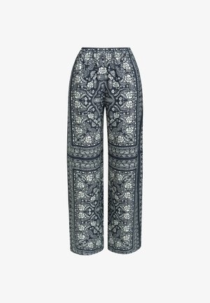 Dunkelblaue, weit geschnittene Hosen mit weißen, filigranen Blumen- und Paisleymustern, die das gesamte Gewebe bedecken.