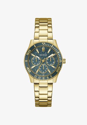 Ρολόι χειρός Guess με χρυσή απόχρωση, καντράν σκούρο μπλε με γκλίτερ, τρεις υποκαντράν, φωσφορίζοντες δείκτες και βραχιόλι από μεταλλικούς κρίκους στον ίδιο τόνο.