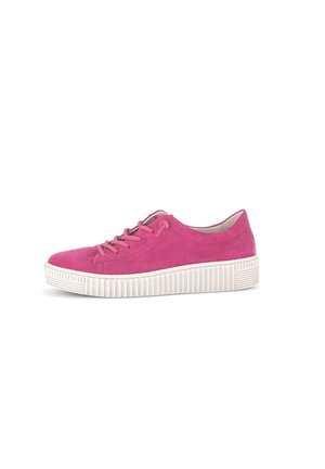 Pink suede sneaker with white rubber outsole, round toe, and lace-up front. Textured detailing on the outsole adds grip.