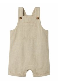 Overol de lino beige con tirantes, detalles de botones de madera y un bolsillo delantero. Presenta un dobladillo con puños y un diseño de corte relajado.