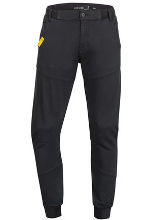 Schwarze taillierte Jeans mit kontrastierendem Panelelement, elastischen Bündchen und einem subtilen Glanz. Verfügt über einen standardmäßigen Knopfverschluss und seitliche Taschen.