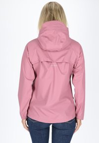Pink waterproof jacket with a hood, elastic cuffs, and a back vent design. Smooth texture, minimalistic branding at the center back.