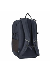 Zaino blu navy con imbottitura posteriore in rete, spallacci regolabili, tasca laterale e manico superiore rinforzato. Tessuto resistente con design minimalista.