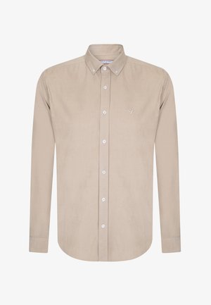 Beige langærmet skjorte lavet af blødt stof med knappet krave, knaplukning foran og et lille broderet fuglelogo.