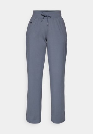 Pantaloni de trening gri dintr-un material moale, cu un talie elastică, șnur la brâu și un logo pe lateral. Design cu picior drept.