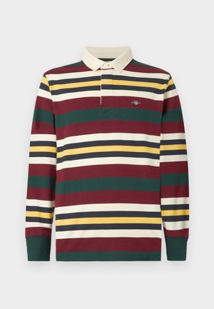 Ilgų rankoviu regbio marškiniai su apykakle, turintys horizontalius raštus vyno raudonos, žalios, geltonos, kreminės ir juodos spalvų, su logotipu ant krūtinės.