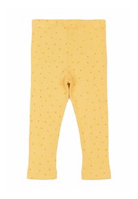 Sárga bordázott leggings kis, illeszkedő pöttyökkel. Rugalmas derékkal és testhezálló fazonnal rendelkezik, a bokáknál szegéllyel.