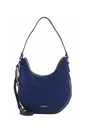 Sac bandoulière bleu marine en forme de croissant avec bordure noire, bandoulière réglable, fermeture éclair et plaque avec le logo "PICARD" à l'avant.