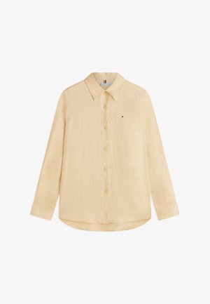 Camicia beige a maniche lunghe con bottoni, collo e piccolo logo ricamato sul petto a sinistra.