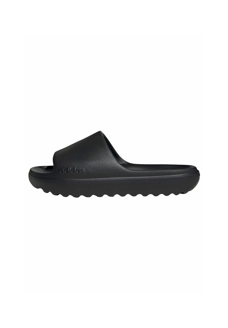 Black slide sandal made from smooth, flexible material. Features a wide strap, rounded shape, and textured sole with ridges for grip.