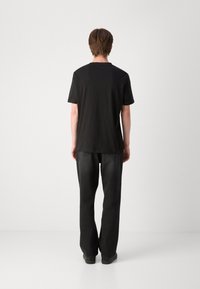 HUGO DIAKROMIO - T-shirt med print - black