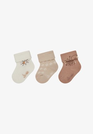 Drei Paar Socken: weiß mit Sonnenmuster, beige mit kleinen weißen Punkten und hellbraun mit einer Linienzeichnung. Alle haben gerippte Bündchen.