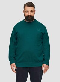 Sweat-shirt vert avec une finition texturée, col rond et manches longues. Présente un petit logo sur le haut de la poitrine à gauche et sur les poignets.