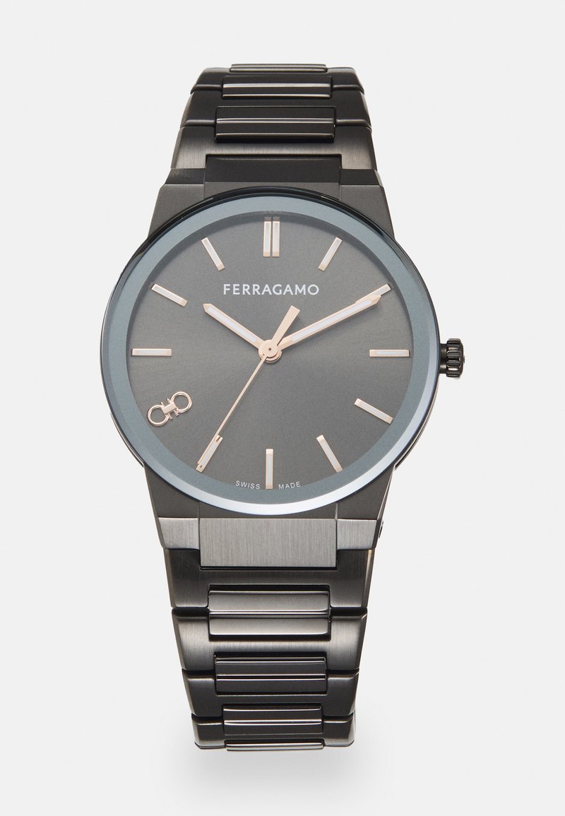 Black metal watch with a round gray dial, rose gold hands, and hour markers. Features a stainless steel link bracelet and a logo. Swiss made.