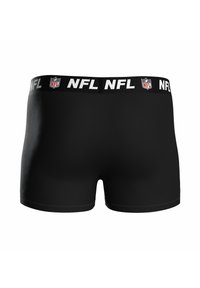 Schwarze Baumwoll-Boxershorts mit breitem elastischen Bund, der das NFL-Logo in Weiß zeigt. Glatte Textur, körperbetontes Design.