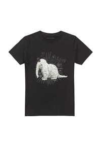 Schwarzes Baumwoll-T-Shirt mit einem weißen, pelzigen Kreaturenmotiv, das den Text "Ich glaube" sowie dekorative Akzente wie Sterne und Herzen enthält.