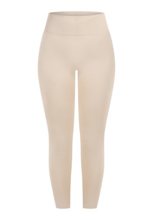 Beżowe legginsy z wysokim, prążkowanym pasem. Tkanina wydaje się gładka, a dopasowany krój sięga do kostek.