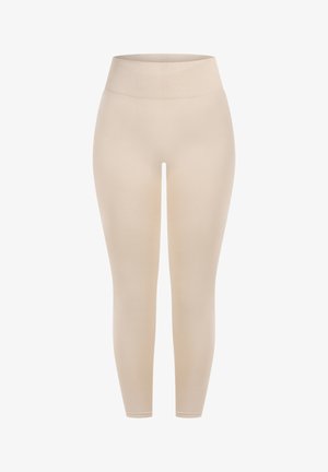 Beżowe legginsy z wysokim, prążkowanym pasem. Tkanina wydaje się gładka, a dopasowany krój sięga do kostek.