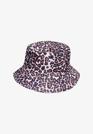 Leopard print bucket hat made of fabric, featuring a round crown, wide floppy brim, and a mix of dark and light brown spots on a cream base.