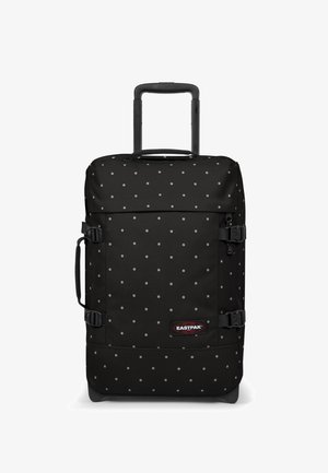 Musta matkalaukku, jossa on pilkkukuosi ja joka on valmistettu kestävästä kankaasta. Varustettu vetokahvalla ja sivuilla puristusremmeillä.