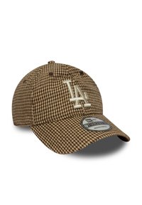 Bruine hoed in houndstoothpatroon met LA-logo. Voorzien van een verstelbare band, gebogen rand en textuurstof. Maatlabel op de rand.