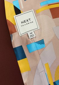 Next MOTION FLEX  - Liemenė - brick red