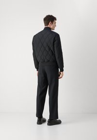 BOSS OSTRONG - Bomber stiliaus striukė - black