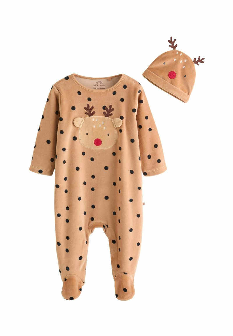 Beiger Fleece-Overall mit schwarzen Punkten, der ein Rentiergesicht und -geweih auf der Brust zeigt. Inklusive passender Mütze mit Geweih.