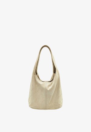 Sac hobo en cuir beige avec une bandoulière large unique et un détail de couture centrale, présenté sur fond blanc.