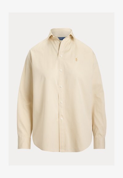 Μπεζ πουκάμισο με μακριά μανίκια και κουμπιά, λεπτές κάθετες ρίγες, γιακάς σε σχήμα spread και κεντημένο λογότυπο στο αριστερό στήθος.