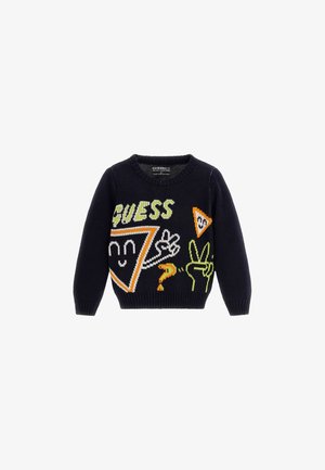 Granatowy sweter wykonany na dzianinie z kolorowymi wzorami graficznymi, w tym tekstem "GUESS", trójkątami i zabawnymi symbolami rąk w kolorach zielonym, pomarańczowym i białym.