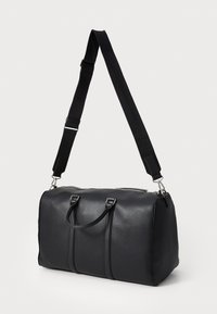 Calvin Klein RAISED LOGO - Sac week-end - black
