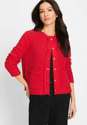 Rode textuur gebreide cardigan met een knoopsluiting aan de voorkant, twee voorzakken en een rafelige zoom. Gemaakt van zachte, gebreide stof. Lange mouwen.