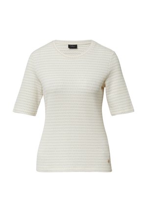 Chemise à manches courtes couleur crème avec un design texturé et côtelé. Elle présente un col rond et un petit logo sur le côté inférieur.