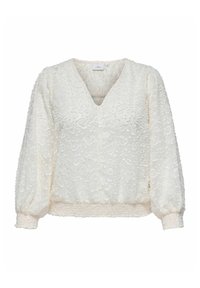 Bijela bluzica s teksturiranim cvjetnim uzorkom, V-izrezom i napućenim rukavima. Ima skupljenu struk i suptilan detalj s dugmadi.