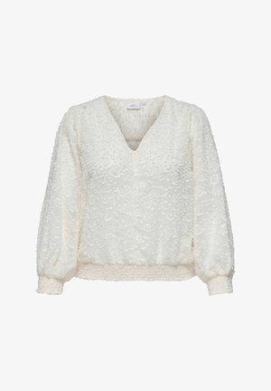 Hvid bluse med tekstureret blomstermønster, V-udskæring og puffede ærmer. Har en samlet talje og diskrete knapdetaljer.