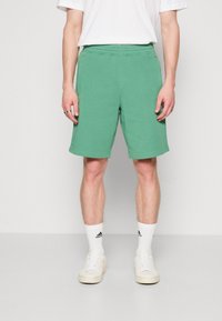 adidas Originals Spodnji deli trenirk - preloved green