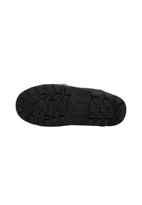 Suela de zapato de goma negra con un patrón de tracción multidireccional, que presenta una superficie texturizada y un acento circular central.